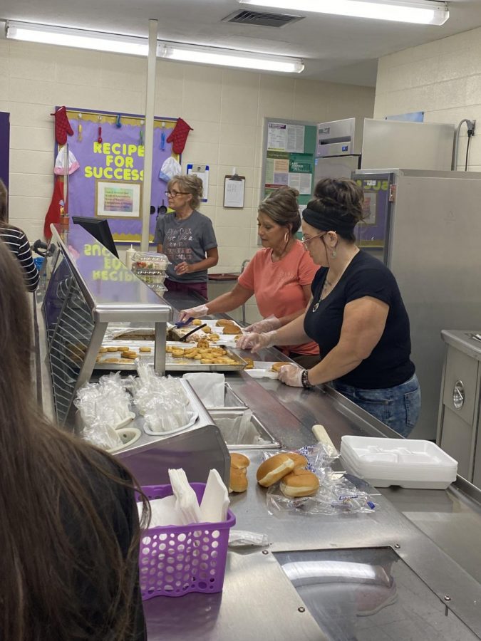 Lunch Ladies serving fourth Lunch Shift
