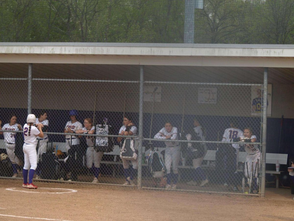 Trojans+cheering+on+their+teammate+from+the+dugout.+