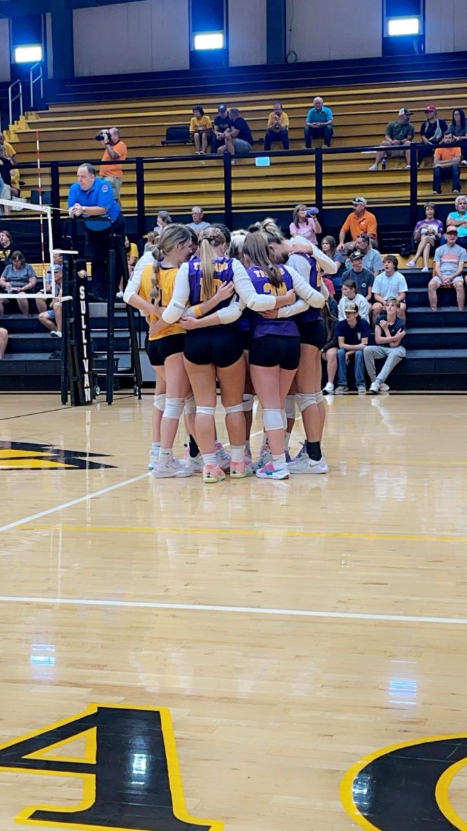 Lady Trojans huddling up before their game.