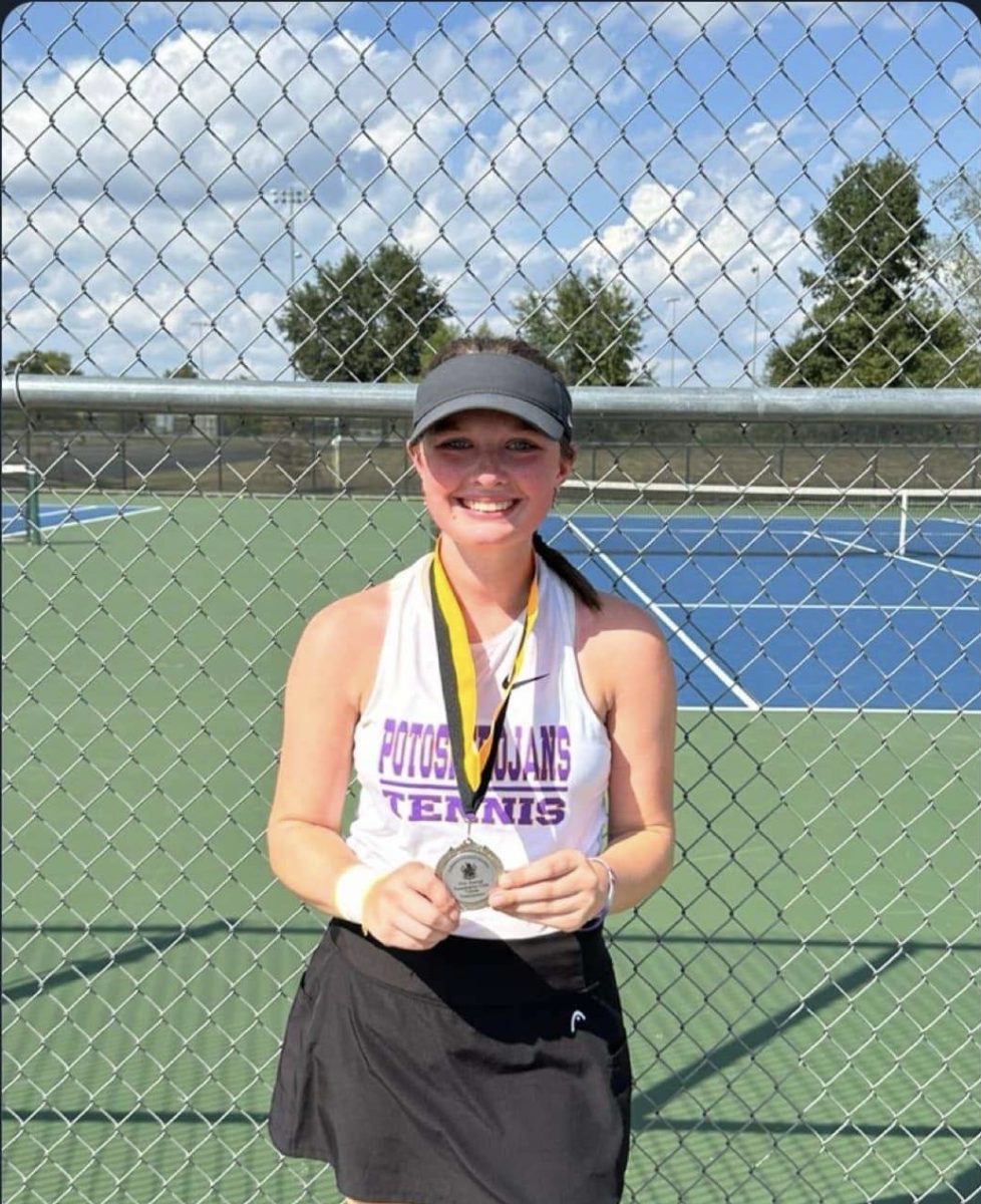 Senior Stella Bourbon received a medal for earning second place in the Farmington Tennis Tournament. 