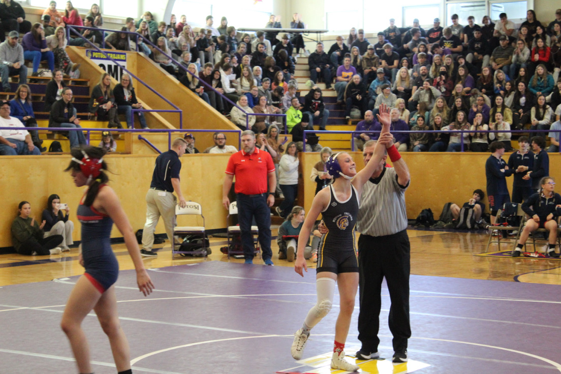 The PHS wrestling team duels in front of the entire student body on Dec. 11. against the Central Rebels